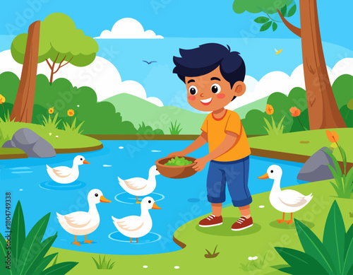 A young boy smiles as he feeds a group of white ducks from a bowl of green food near a riverbank on a sunny day.