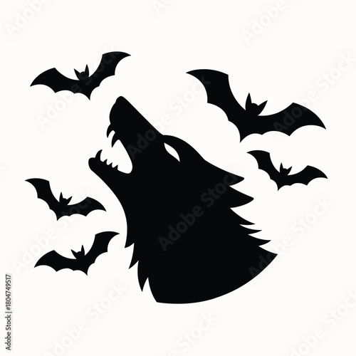 Silhouette of a howling wolf with bats flying around it