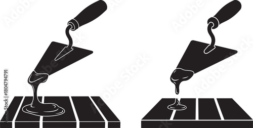 Two trowels applying mortar to pavers silhouette