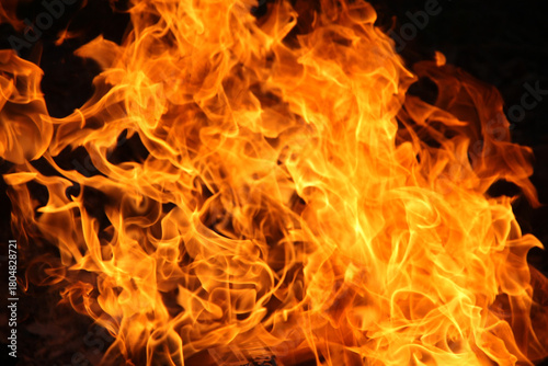 Blurred illustration of burning fire flame. Burning fire flame on black background.