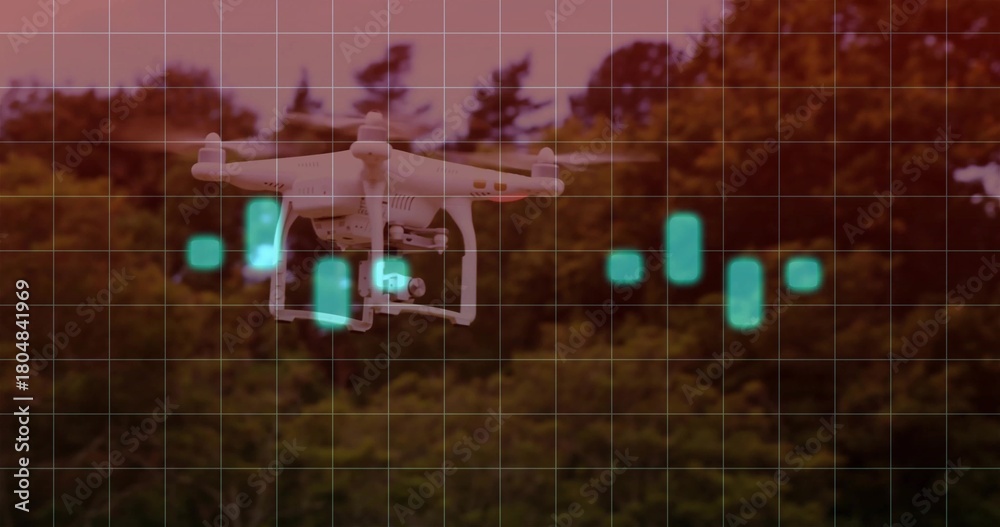Fototapeta premium Hovering white quadcopter showing gimbal and four propellers over tree line, teal HUD grid
