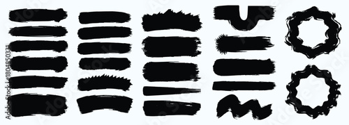 Collection of rough black brush stroke textures and organic shapes on a white background