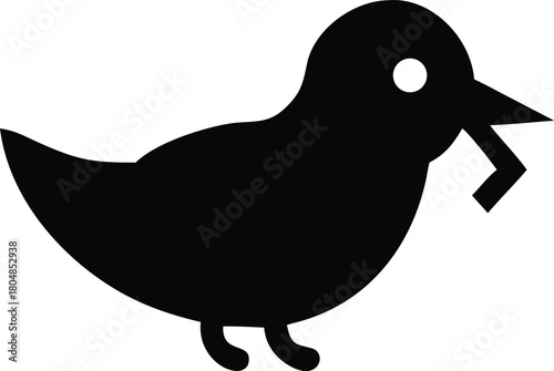Black silhouette of a bird holding a small object in its beak