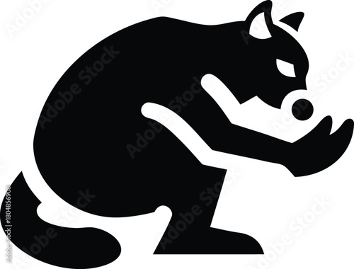 Black silhouette of a fox looking at a ball white background