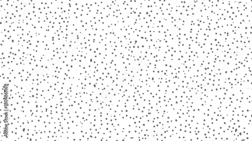 A seamless pattern of scattered irregular grey dots on a white background creating a textured abstract surface