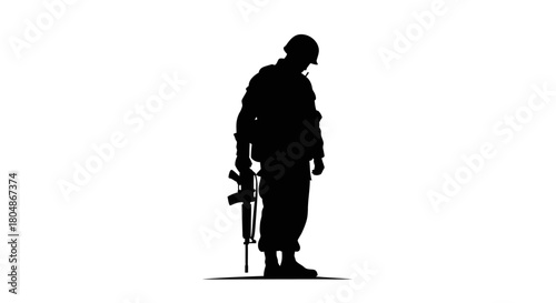 Silhouette of a soldier standing with a rifle, head bowed in solemn reflection.