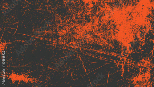 Dark gray background with distressed orange scratches and speckles abstract texture pattern grunge