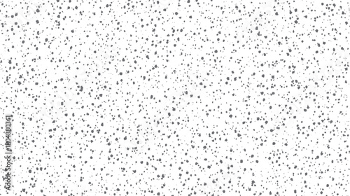 Speckled grey dots scattered randomly across a clean white background creating a subtle textured pattern