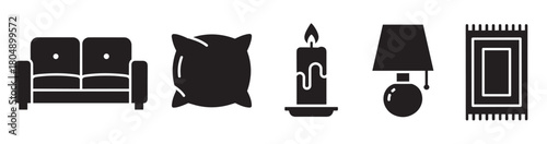 A collection of black silhouette icons representing home furnishings and decor, including a sofa, pillow, candle, lamp, and rug, in a clean, minimalist vector style