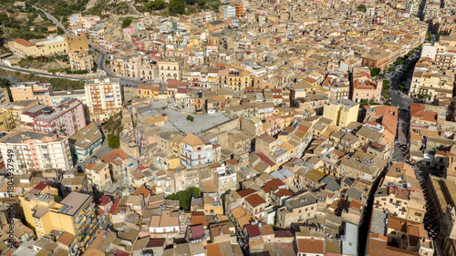 Fototapeta Naklejka Na Ścianę i Meble -  Aerial view of the historic center of Licata, a small town in the province of Agrigento, Sicily, Italy. There are many houses and buildings lined up next to each other.