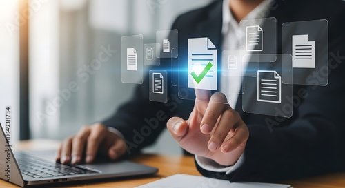 Business professional interacting with digital documents and approval icons on screen