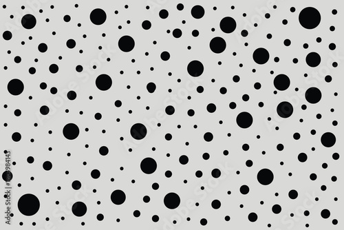 Abstract black polka dot pattern on a white background creating a visually dynamic and modern textured surface for design