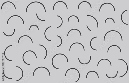 Abstract pattern of scattered black curved lines on a white background creating a dynamic and playful visual texture