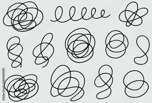 Collection of abstract hand drawn black ink scribbles and doodles representing chaos and creativity in various forms