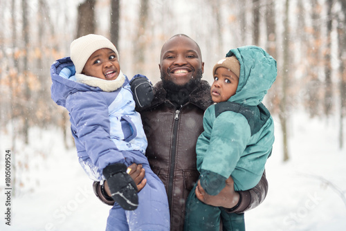 father his two child in winter forest with parents and kids love relationship having warm clothes for cold climate