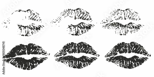 Collection of six black lipstick kiss prints on a white background