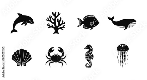 Silhouette icons of marine life: dolphin, whale, coral, and more