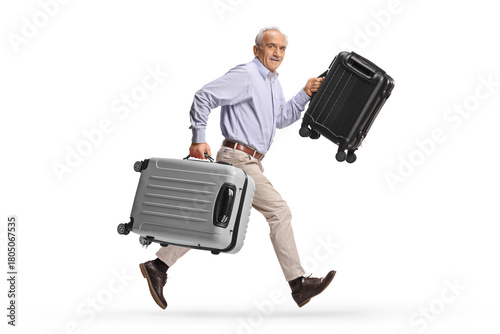 Elderly man running with suitcases