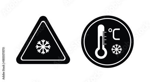 Black and white warning signs depicting ice and freezing temperatures
