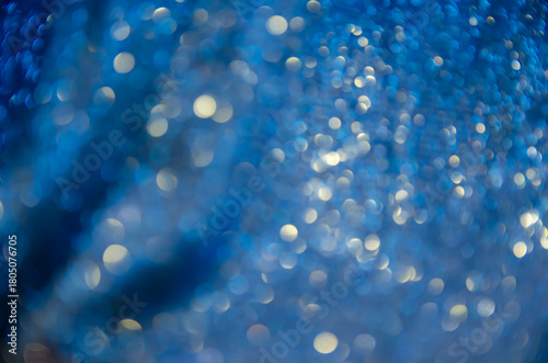 Blue glow. Abstract background. Light and bokeh. A bright holiday template. Background for congratulations.