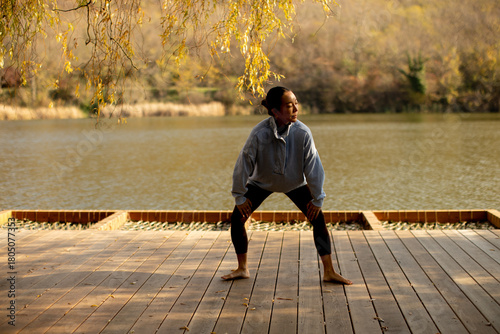 Korean woman practicing yog...