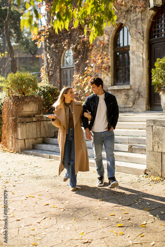 Couple enjoys a sunny strol...