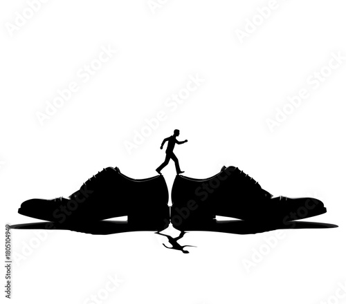 A striking black-and-white silhouette captures a lone figure walking across the gap between two oversized shoes. Reflections below enhance the surreal
