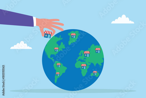 Vector illustration of a hand placing small shops around the globe, symbolizing global business expansion, international growth, franchise development, and worldwide market reach