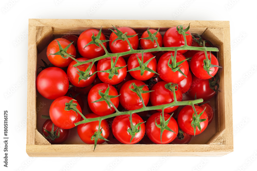 Obraz premium Cherry tomato bunch in a wooden box isolated on white background. Top view. Flat lay