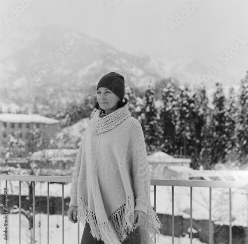 Winter in Batoumi. A young woman smiling with a snowy landscape in the background. Georgia - February 2025. 