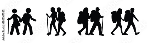 Hiking couples silhouettes walking with poles and backpacks