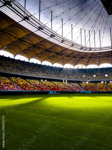 Massive Soccer Stadium Filled. Wide view of empty stadium. Green grass on a sport Arena. Empty Football Soccer Stadium Tribune. National arena with empty seats. Sport event on National Arena. 