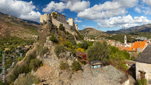 Tableau sur toile famous restored citadel and historical city of corte in corsica france on rock wide panorama