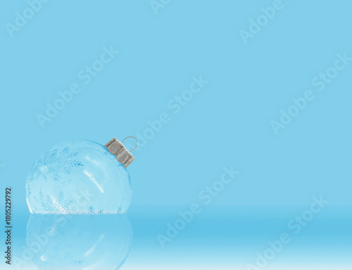 Festive ornament with snowflakes light blue background. Merry Christmas and Happy New Year Holidays