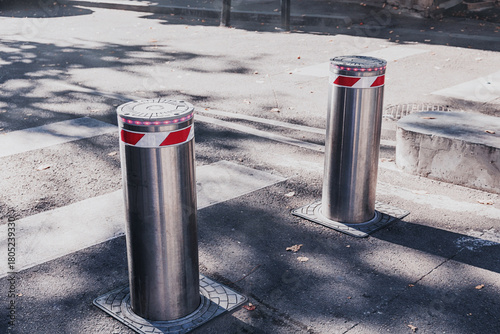 Two stainless steel security bollards with flashing lights provi