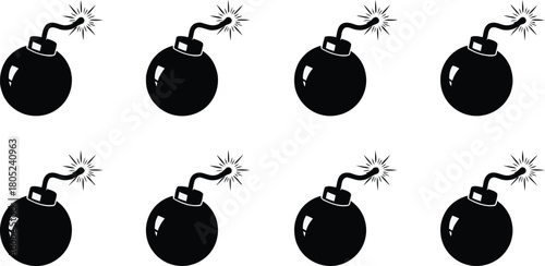 Eight black cartoon bombs with fuses lit, ready to explode