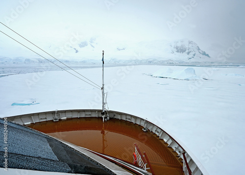 A ship pokes its way into sea ice in Antarctica.