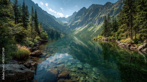 Fototapeta Naklejka Na Ścianę i Meble -  Pristine Morskie Oko lake reflects mountain peaks and lush forest in Tatra National Park