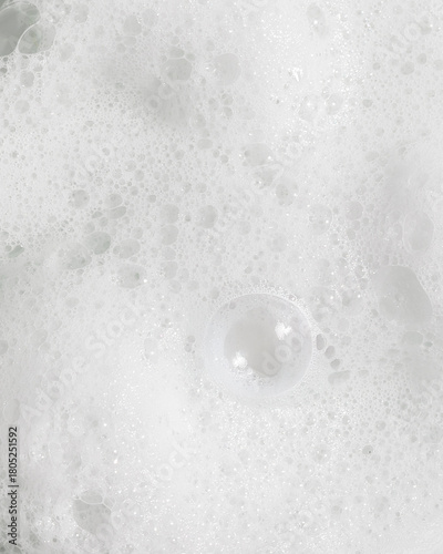 Macro texture photo of white foamy soapy bubbles