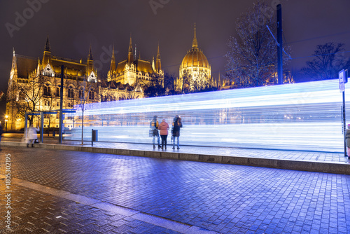 Photography Budapest's specially illuminated Christmas tram on line 2 in front of the Parlia
