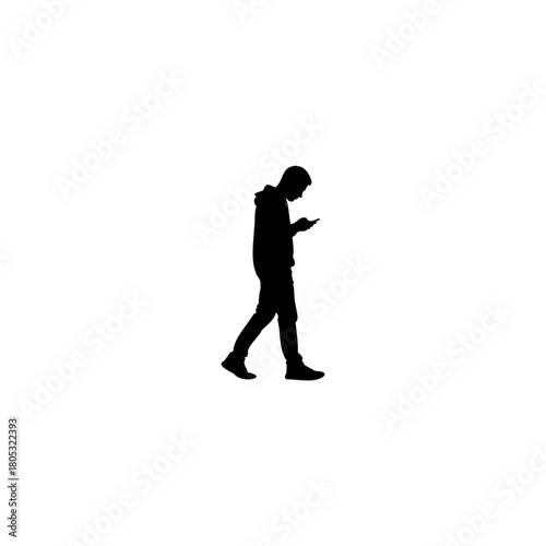 Man checking smartphone walking alone, a modern silhouette conveying loneliness or digital dependence