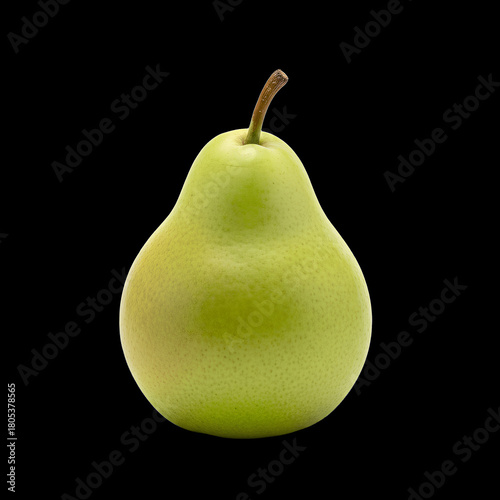 Single ripe green pear with stem isolated on a black background
