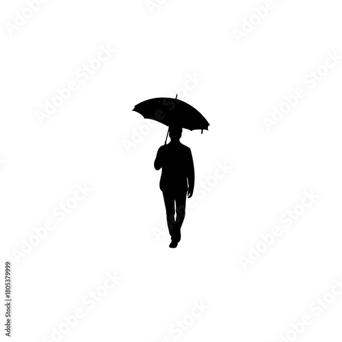 Silhouette of a man walking with an umbrella, conveying solitude and a sense of journey.
