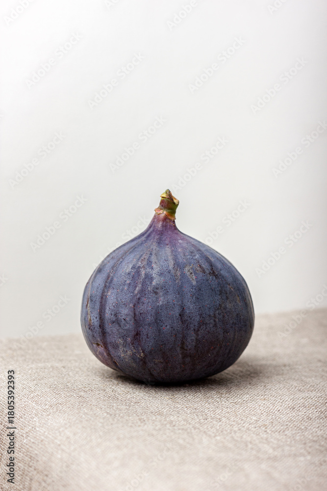 Fototapeta premium Fresh fig on a light background.