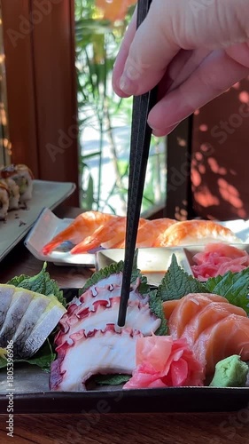 Indulge in a Delicious Assorted Sushi Platter featuring fresh Salmon and delightful Veggie Rolls
