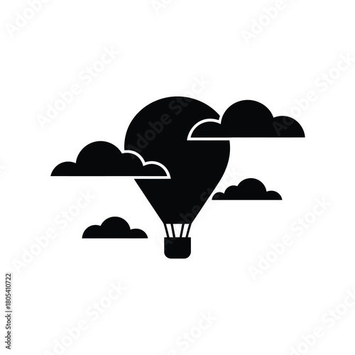 Hot air balloon floating among clouds silhouette