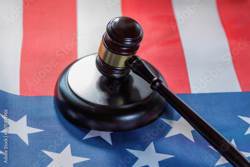 Gavel resting on an American flag symbolizes law and justice in the United States