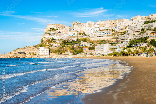Fototapeta Naklejka Na Ścianę i Meble -  Peaceful sandy beach and breakwater along the Adriatic shoreline near Peschici, Apulia, Italy