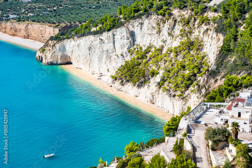 Fototapeta Naklejka Na Ścianę i Meble -  Turquoise sea and white cliffs forming a secluded Zagare beach along the Gargano coast, Apulia, Italy