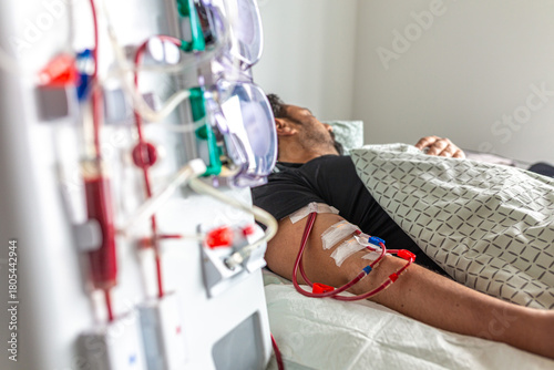 Germany, Bavaria, Munich, Portrait photograph of a man in the dialysis unit of a hospital